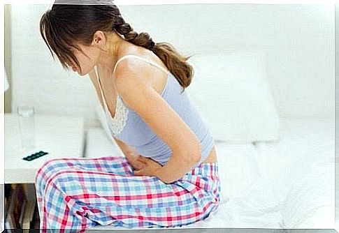 Woman with stomach pain due to damaged intestinal flora