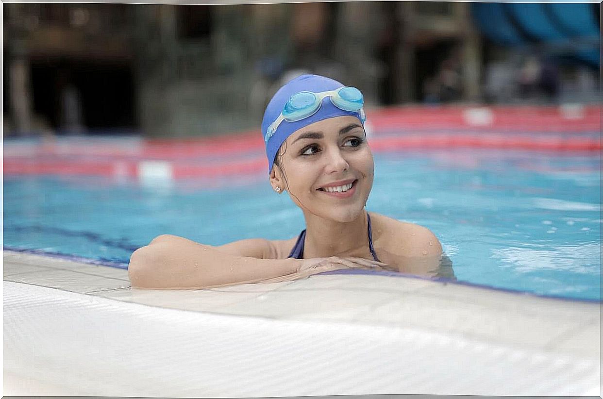 Woman in the pool enjoying the benefits of swimming.