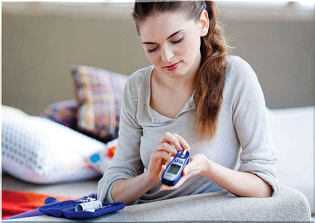 woman measuring blood sugar