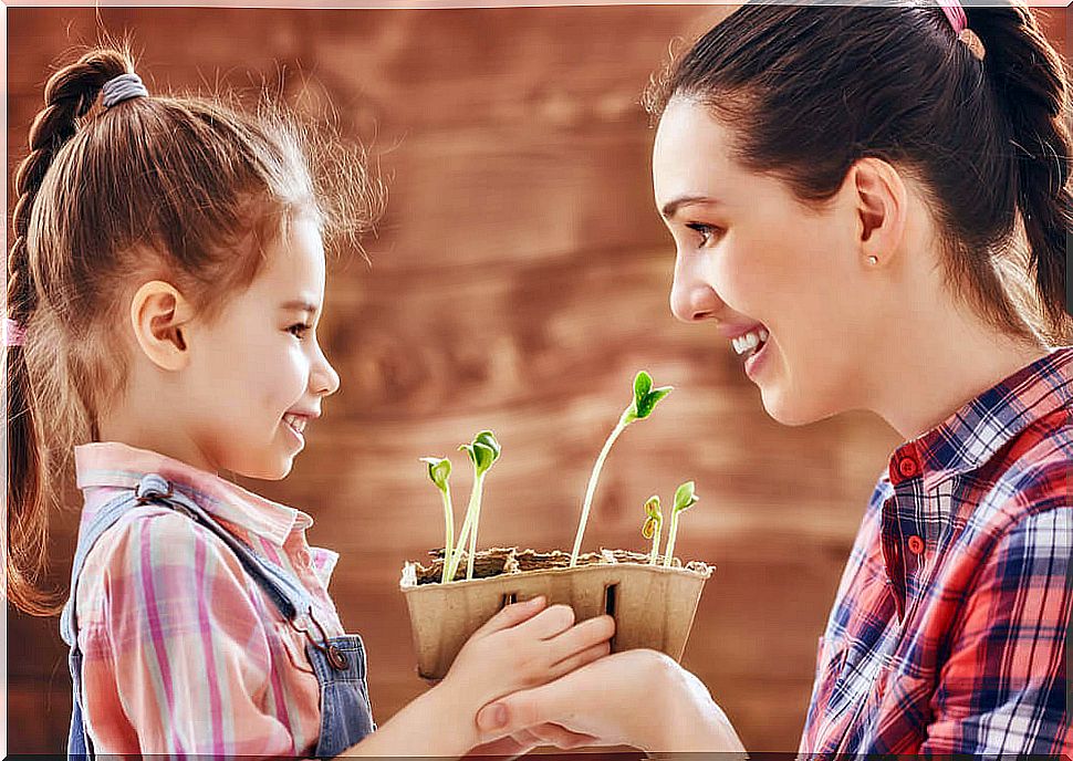 Daughter with her super mother planting