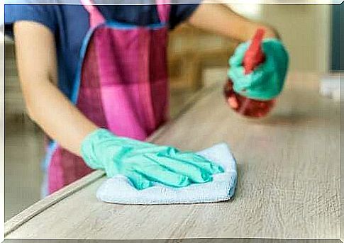 Woman wiping cloth with vinegar