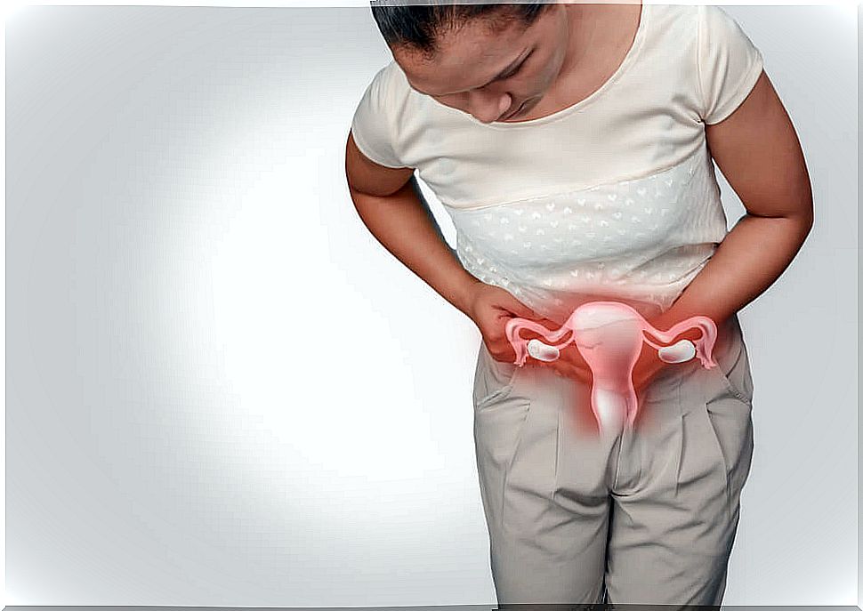 Woman holding ovaries with menorrhagia.