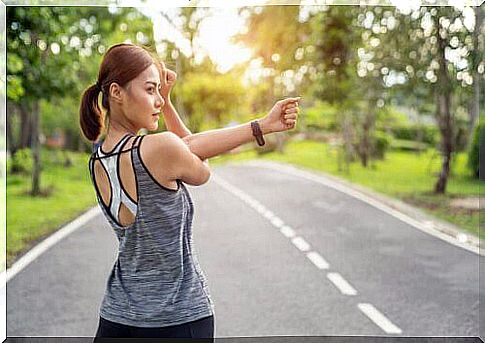 woman stretching her arm